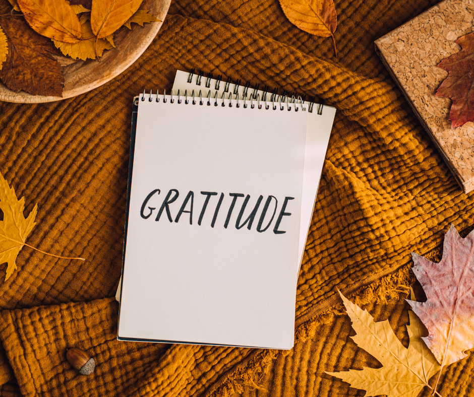 gratitude note on brown cloth with autmn leaves